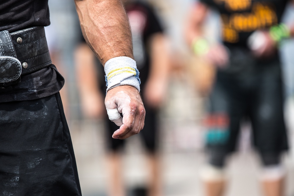 Closeup of athlete hand before his attempt to lift barbell.jpeg