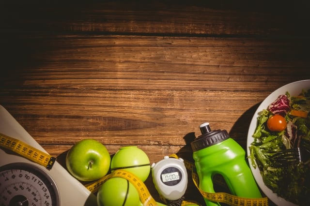 Indicators of healthy lifestyle on wooden table.jpeg