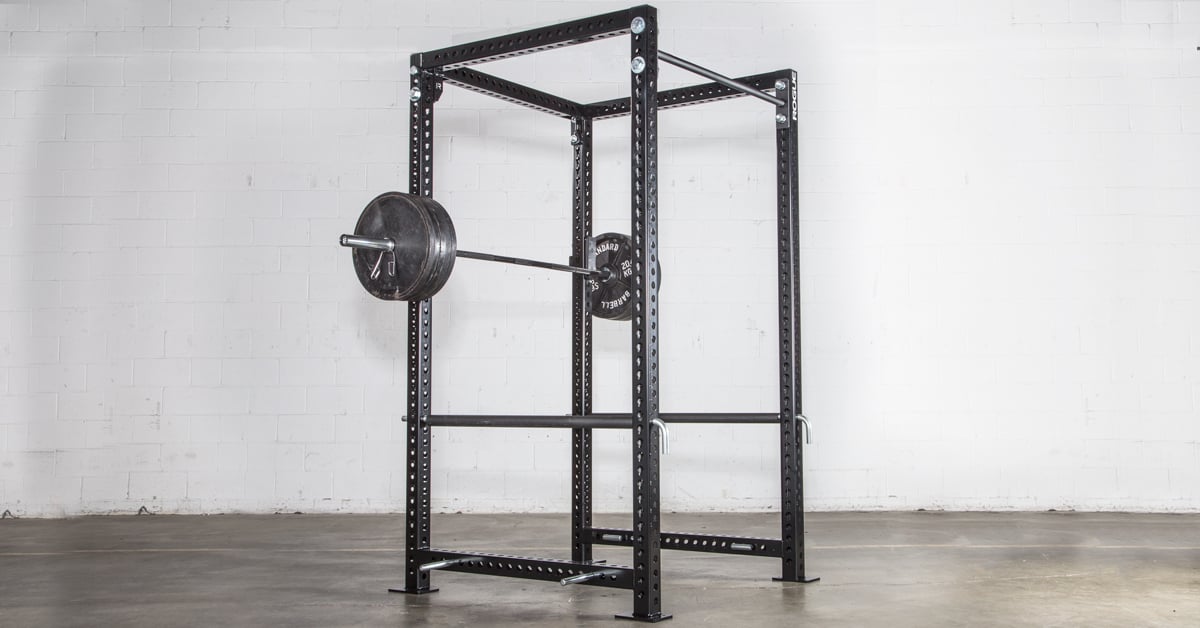 Squat rack with bar and weights